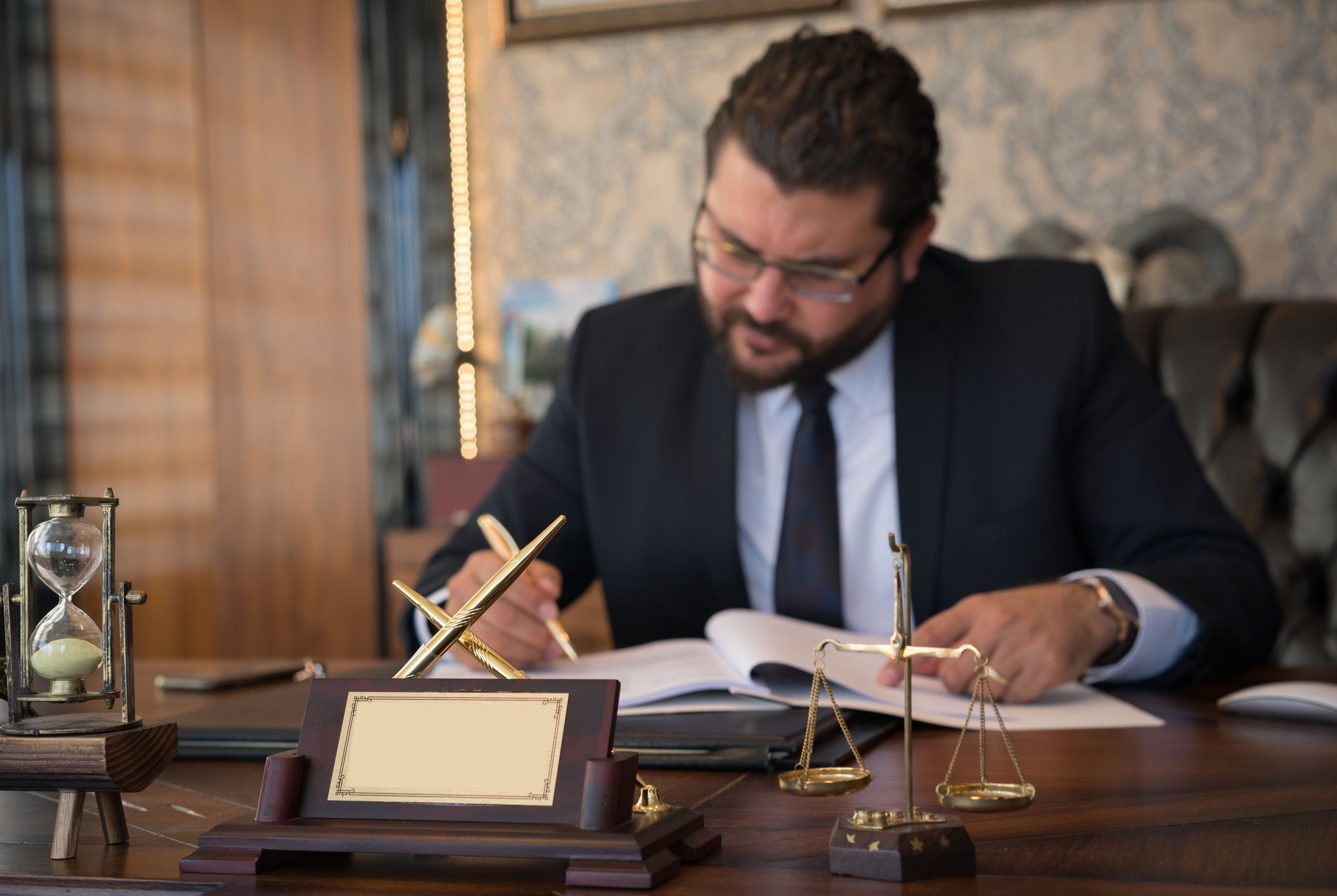 Caucasian lawyer signing documents in office